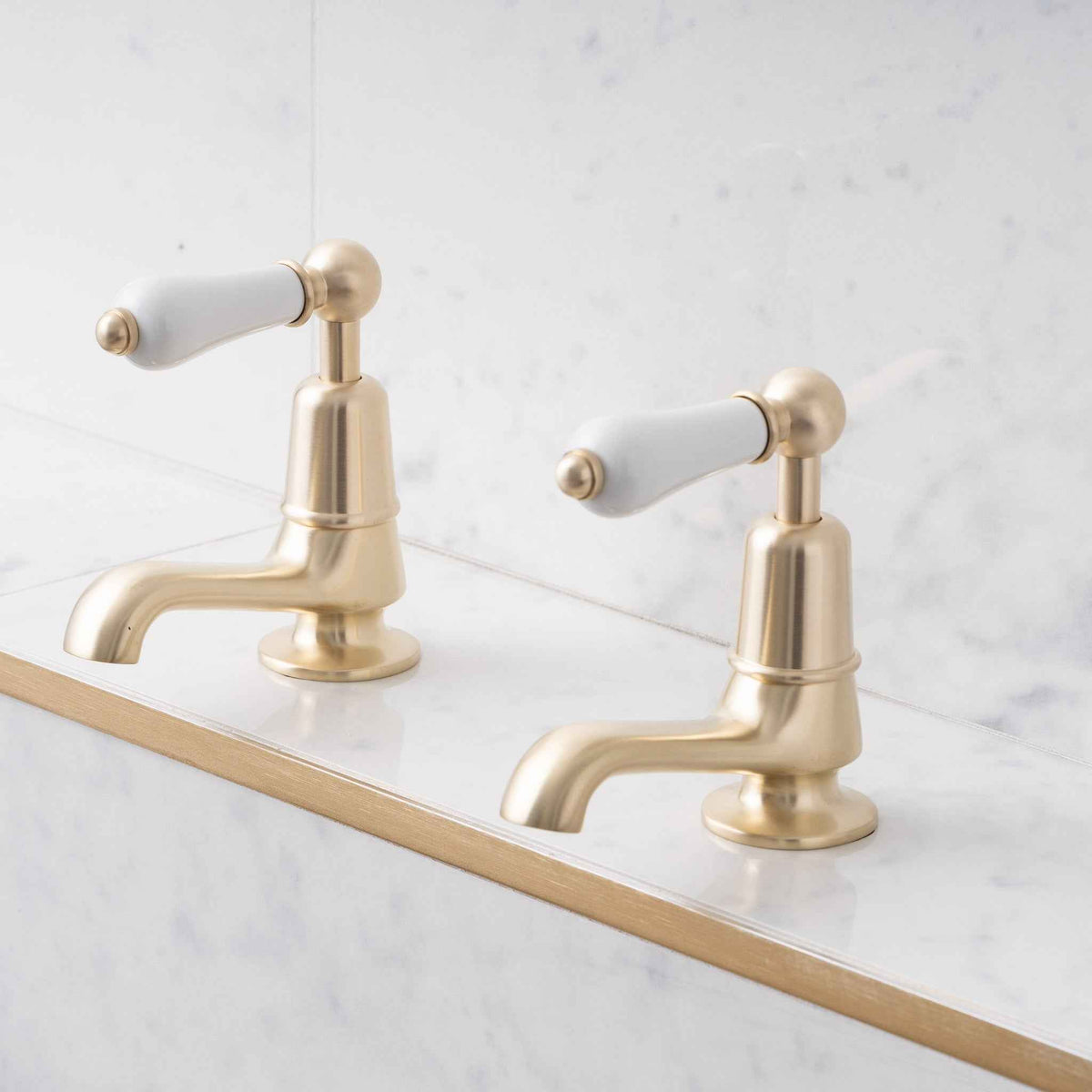 Brunswick White Ceramic Lever Basin Pillar Taps - Rutland London