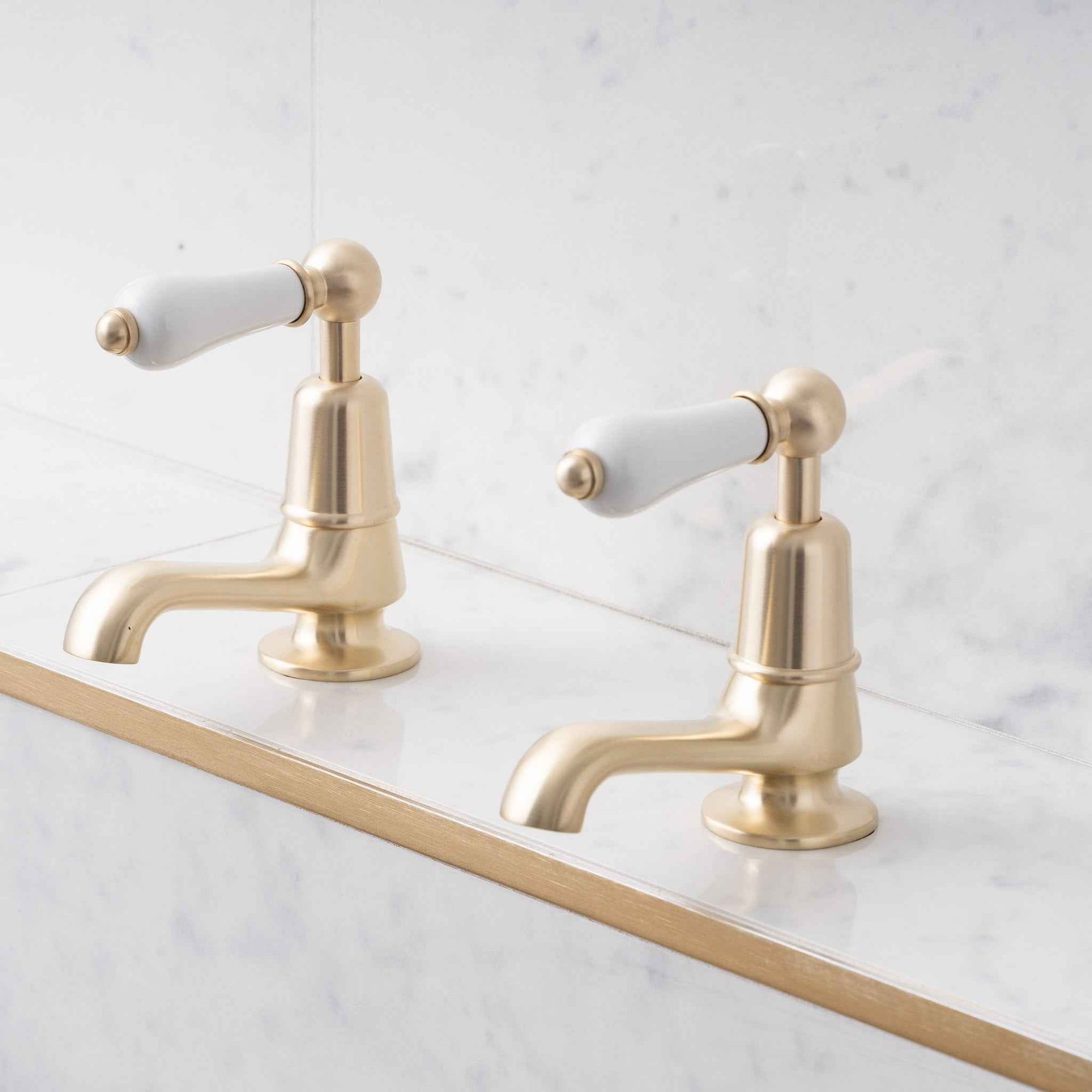 Brunswick White Ceramic Lever Basin Pillar Taps - Rutland London